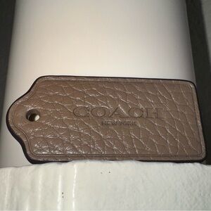 Coach New York, Pebbled Leather Hang Tag Fob Brown Taupe Color 2x1